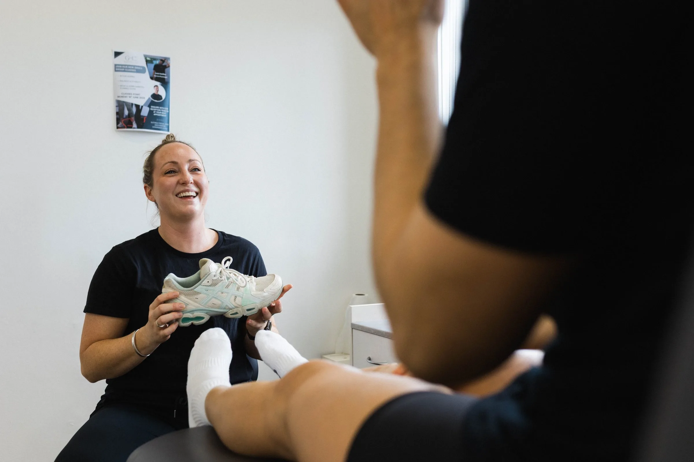 Practitioner treating a patient in a treatment room at Gladesville Healthcare