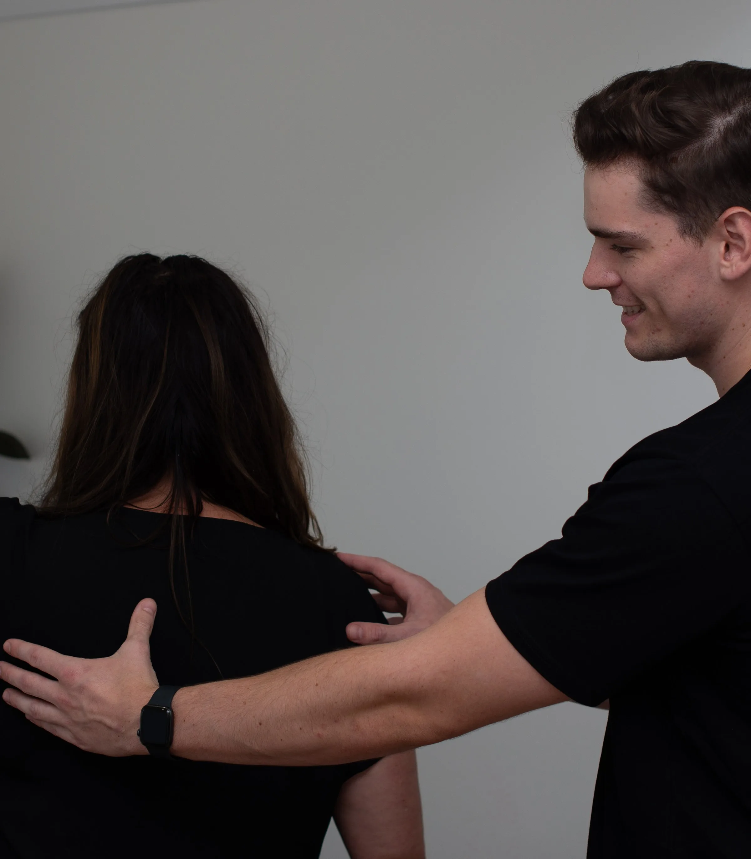 Physiotherapist treating a patient's shoulder