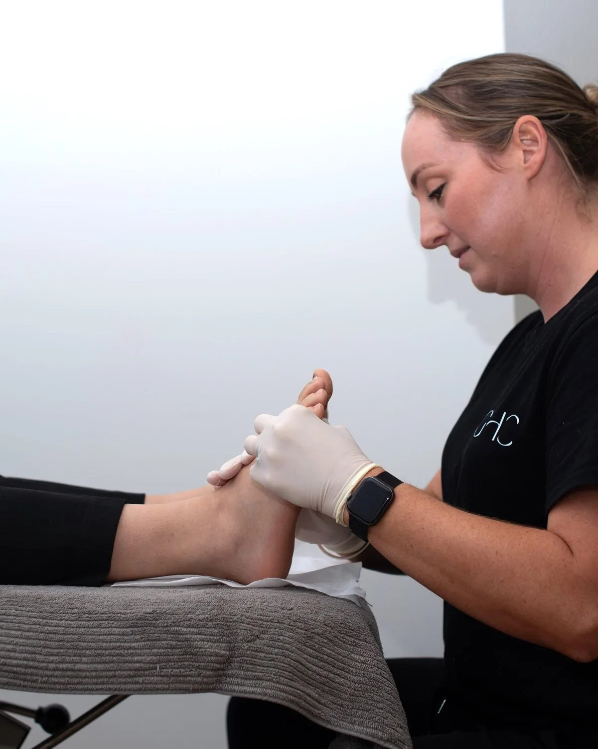 Physiotherapist guiding a patient through hands-on treatment